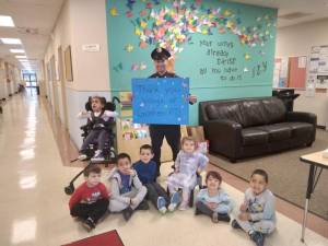 Ptl Tyler Gennarelli was presented with a Thank You poster by the children and staff of Inspire Kids.