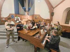 Warwick Valley Chorale singers during a solo rehearsal, with direction by Ron DeFesi.