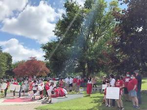 Students of Sacred Heart School in Monroe and their parents protest the decision by the Archdiocese of New to close their Catholic elementary school and another in Warwick and merge the student population at St. John’s in Goshen. A similar protest is taking place in Warwick.