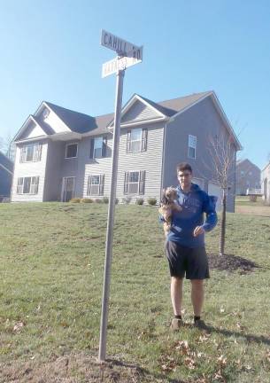 Will O'Brien, holding Sasha, lives at the corner of Harness Road and Cahill. He told The Chronicle some residents haven't had mail delivery for more than six years.