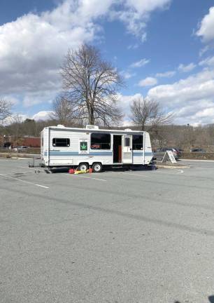 A Winnebago in a corner of the Wal-Mart parking lot in Harriman, N.Y., has jars labeled with the type of pot, pre-rolls and edibles like chocolates and gummies.