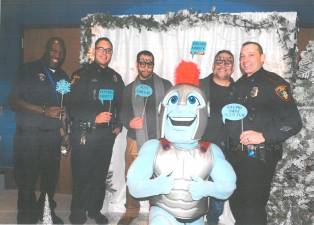 L-R: Atlas Security’s Ralph Surray, Ptl. Christopher Perez, Assistant Principal Dr. Gregory Voloshin, Principal Nick Pantaleone, SRO Brandon Raab, and the Goshen Gladiator.