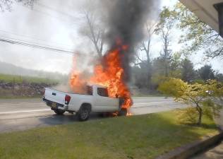This truck burst into flames on Route 17M/Brookside Avenue in the Village of Chester on Friday, May 15. Orange County Fire investigators said the cause of the fire was a problem with the brake lines. Photo by Cliff Patrick.