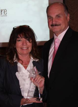 Lynn Allen Cione is pictured with Inspire&#x2019;s President and CEO, Marcel Martino (Photo provided)