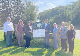 Assemblyman Colin Schmitt presents a $25,000 grant to the Chester Public Library to help the library purchase new e-readers and, for the first time ever, WiFi hotspots available for check out by library patrons.