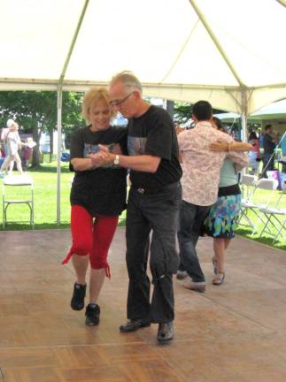 Jerry and Adele Kline of Middletown, married 52 years, dance the tango at the Tango Under the Tent dance floor.