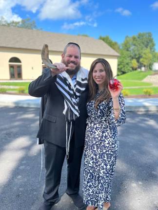 Rabbi Pesach and Chana Burston, director of Chabad of Orange County, blows the Shofar and invites the community to hear the sounding of the Shofar on Rosh Hashanah