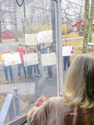 So Belle Rosmarin’s children and grandchildren surprised her with a birthday celebration that she got to enjoy through the window. They sang, held up signs and balloons and read her a specially written poem.