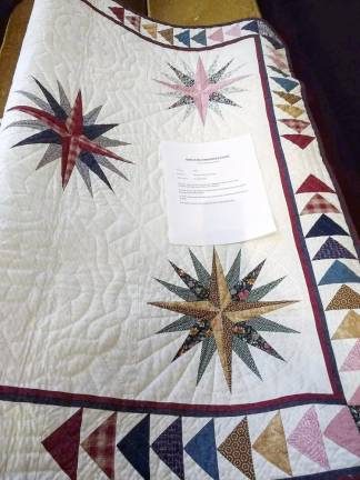 Star quilt made in 1994 by the late Charlene Smith Klieverik and owned by Ron Klieverik. Charlene was born and raised in New Hampshire and for many years designed and made much of her own clothing. In 1990 she moved with her husband and son to Holland, where she started designing and making quilts. In 1995 she moved to Goshen, where she continued her craft until her passing in 2004. Charlene's quilts continue to be enjoyed by her family and friends.