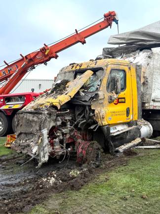 A tractor-trailer traveling south on Hatfieled Lane lost control and struck a fire hydrant, utility box and building.