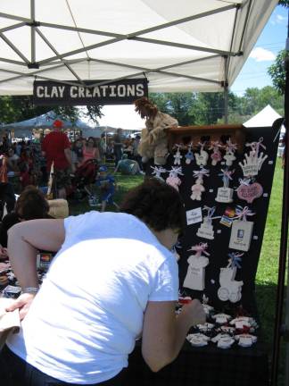 A visitor examines the wonderful items at Clay Creations.