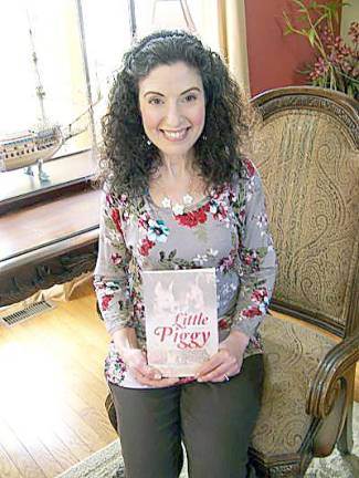 Laurel Kuenzler with her book, Little Piggy (Photo provided)