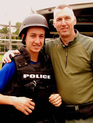 Officer Johnny Motz and his son Jacob of Chester (Photo by Ed Bailey)