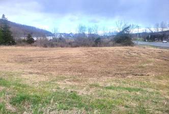 One of the vacant residential lots on Well Sweep Lane and Pewter Circle.