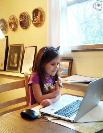 Granddaughter Isla Reilly participates in distance learning.