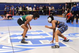 Dominick Jean-Pierre (right) is emerging as a leader in boys wrestling