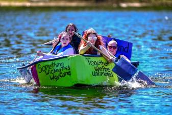 A team competes in the 2025 Cardboard Boat Regatta in Port Jervis.