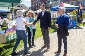 Congressman Pat Ryan visits the village of Warwick and shakes hands with community members.