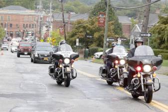 Fire departments escort body of Charles Niemann, 60-year fire service volunteer