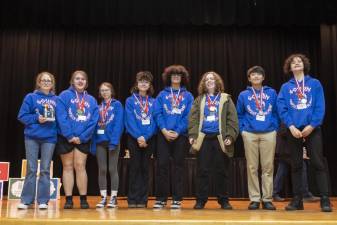 (L-R) Heidi Seligman, Katie Thornell, Carly Seligman, Madison Hunter, Nathan Hulse, Hannah Barhorst, Allen Yi, and Sion Siljokovic. The Goshen High School team won first place in their division at the Odyssey at the Mind Tournament on March 4, 2023.