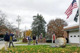 On this most solemn of days, there was no public ceremony due to the Covid-19 pandemic. Nevertheless, four veterans paid homage to our veterans. Ed Johnson, Commander of American Legion Orange Blossom Post 1167, laid a wreath at the memorial outside the Chester Firehouse. Also present were veterans Steve Neuhaus, Orange County Executive; Joe McCourt, president of the Chester Fire Police; and E.J. Szulwach. Photo by Ginny Privitar.