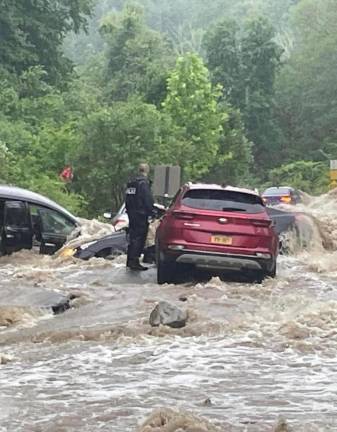 Park Police come to the rescue of stranded motorists in the Hudson Valley when flood waters turned roads into rivers.