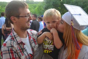 New graduate Lena Lopez-Evans with her siblings.