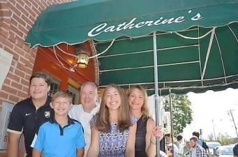 Catherine’s Restaurant owner and chef Stephen Serkes with his family at the entrance of the Goshen mainstay: Sons Stephen and Daniel, Stephen, daughter Morgan and wife Jennifer. The restaurant reopened this week after a hiatus due to coronavirus concerns. Photo source: usarestaurants.info.