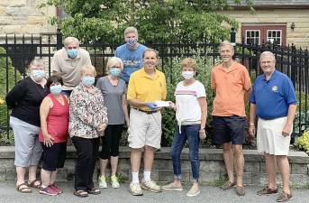 The Goshen Rotary Club recently donated $625 to the Goshen Food Pantry. Pictured are food pantry volunteers Debbie Matyus, John Strobl, Leslie Dowie, Patty Griffin, Mark O’Hara and Betty Smith, and members of the Goshen Rotary Club president Mark Gargiulo, secretary Ron Klieverik and treasurer Rolly Peacock. Photo provided by Ron Klieverik.