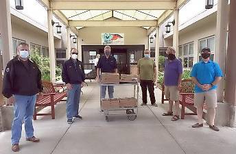 On May 22, members of the Goshen Knights of Columbus #1106 delivered 13 pizzas pies, purchased from Amore's in Goshen, to the Valley View Center. Pictured from left to right are John Paulus, John Shields, Mark O'Hara, Mark LaBruna (also a Knight and Valley View director), Ken Newbold and Darren Gamma. Provided photo.