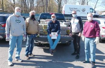 On Friday, April 17, five members of the Goshen Knights of Columbus #1106 drove to Cornwall (of course, in separate cars for social distancing) to the Hudson Valley Food Bank to re-fill the Goshen Ecumenical Food Pantry. This project was driven by Brother Mark O'Hara. The pantry feeds more than 250 people every two weeks through drive-through distribution events. The distribution takes place on the second and last Saturday of each month at the parking lot of the Presbyterian Church. Pictured from left to right are: Mark O'Hara, Ken Newbold, John Carey, Dr. John Carey and John Shields. For information about the pantry, call 845-772-1088 or visit facebook.com/Goshen Ecumenical Food Pantry/