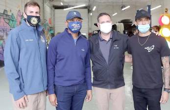 Pictured from left to right are: Assemblyman Colin Schmitt, Mariano Rivera, Orange County Executive Steven M. Neuhaus and Mariano Rivera Jr. at Mr. Auto Body in Chester on Saturday, Oct. 24. Provided photo.