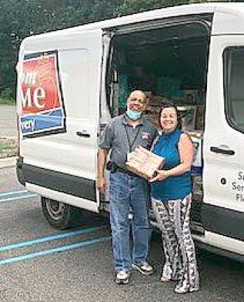 Chester Town Clerk Linda Zappala accepted the first delivery of food from ShopRite from driver Lee Walden on Tuesday, Aug. 18. Provided photos.