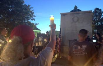 People paid tribute to activist Charlie Kirk in Village