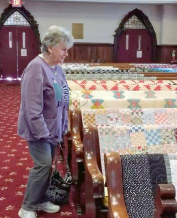 MaryEllen Count from Blooming Grove admires the quilts