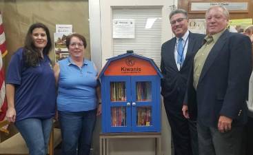 With the book box at Village Hall (from left): Danielle August, past-president of Kiwanis Club of Chester and chair of the book box program; Susan Bahren, president of the Kiwanis Club of Chester; Denis Petrilak, Chester Superintendent of Schools; and Chester Mayor Tom Bell.