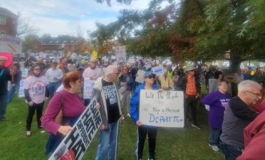 Hundreds rally at Village Green ‘No Kings’ protest