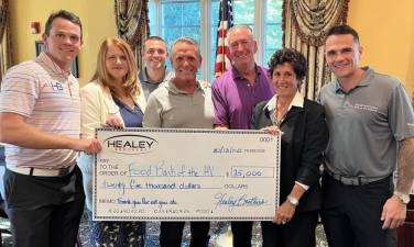 L-R: Dylan Healey; Sara Gunn, director of the Food Bank of the Hudson Valley; Brian Healey, director of used car operations; Dwight Healey, dealer principal of Healey Brothers Automotive; John Koerner, executive general manager of Healey Brothers Automotive; Marcia Jacobowitz, project consultant for the Regional Food Bank of Northeastern New York and Jason Healey, Healey Brothers’ chief marketing officer.