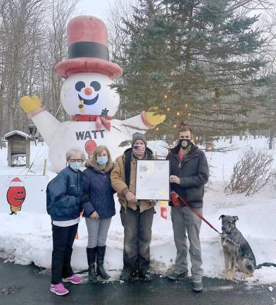 Assemblyman Colin J. Schmitt presents the Watt family in Goshen with state honors, a State Assembly Proclamation, for spreading “Christmas joy throughout our region.”