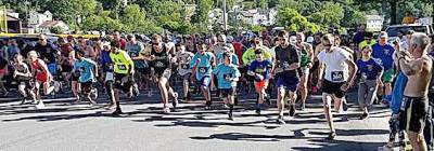 This is a scene from a previous 5k race sponsored by the Kiwanis Club of Chester. For its 26th edition of the race, the club has put in place safety measures for the volunteers and the participants. Provided photo.