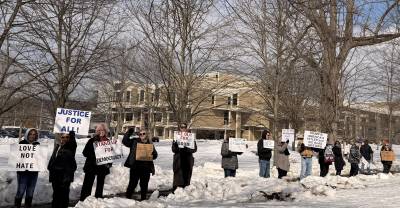 Approximately 50 protesters gathered outside the Orange County Government Building on Feb. 14., a day after the U.S. Department of Immigration and Customs Enforcement (ICE) announced it purchased the former Pep Boys Warehouse in Chester.