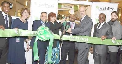 At the ribbon cutting to open the Healthfirst retail location at the Galleria at Crystal Run in Middletown (from left): Roland Foster, Healthfirst; Liz Redner, Healthfirst; Ricky Pafundi, Healthfirst; Darcy L. Shepard, CEO, Middletown Medical; Errol Pierre, Healthfirst; Bill Scesney, AVP Montefiore Health System; Lazare Pouani, Healthfirst; and Kyle Russo, Practice Manager, Cross Valley Health.
