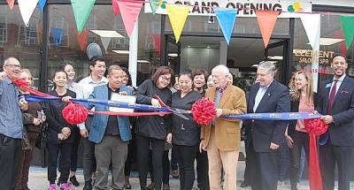 Friends, relatives, co-workers, and town officials are delighted to watch owner Dawn Zleng cut the ribbon, symbolizing the grand opening of Element Salon &amp; Spa on Main Street in Goshen.