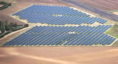 Cloudy skies over commercial solar farms