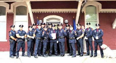 Village of Goshen Police Department members with Brandon Raab.