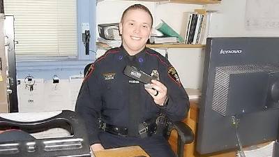 Patrolman Robert Kozlowski with the Village of Goshen Police Department holding the CAT Application Tourniquet that aided in saving the life of a Goshen woman. Officer Kozlowski calls it an invaluable tool in halting uncontrollable bleeding and saving lives.