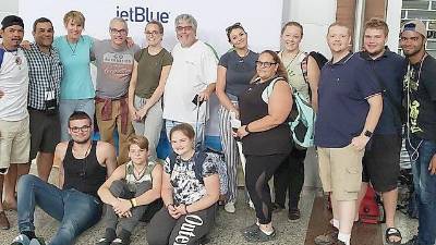 Front row (from left): Charles Phelan, Matt Csernai, Emma Boardman. Back: Hugo Chavez (from Bridges to Community), Mark Glasse, Carol Phelan, Ken Crosby, Shannon Roper, Scott Roper, Carly Glasse, Allison Csernai, Tierney Crone, Robert Boardman, Trent Larson, Louis Gonzales.