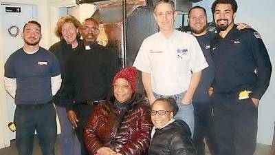 Mary Sumter and her daughter Marcia Terrell, upfront, are happy to get a new furnace for St. John’s AUMP Church. With them, are (from left): Fausto Palumbo, volunteer Diane Dinan, the Rev. Brazley Young, Jeff Abraham, Nick Brown, and Jericho Male. Palumbo, Brown, and Male installed the new furnace, donated by Astar Plumbing, Heating and Air Conditioning.