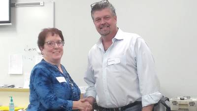 Sue Bahren congratulates Bob Valentine on his victory at the ballot counting at the Orange County Board of Elections in Goshen.