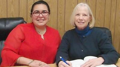 Nancy Hom George (right) signed on as the new Village of Chester Historian after being appointed by Mayor Tom Bell. Village Clerk Rebecca Rivera is pictured on the left.